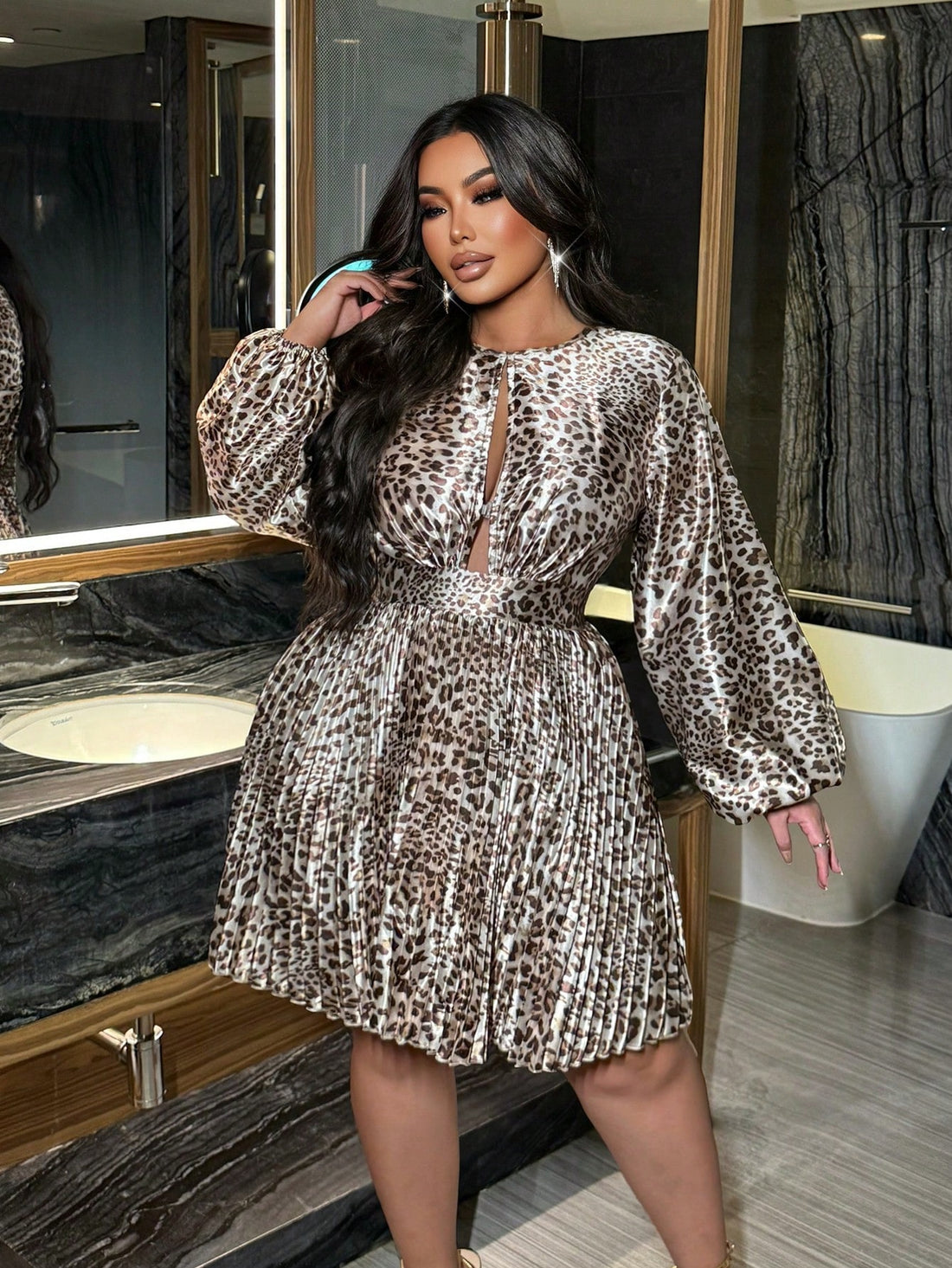 Roar into the room in this fabulous plus-size leopard print dress! Featuring timeless vintage vibes and a flattering pleated silhouette, this showstopper is your ticket to turning heads at any celebration. The classic animal print never goes out of style, while the thoughtfully designed cut ensures you'll feel confident and gorgeous from cocktail hour through the last dance. Perfect for parties, date nights, or whenever you want to channel your inner wild child with elegance and flair.