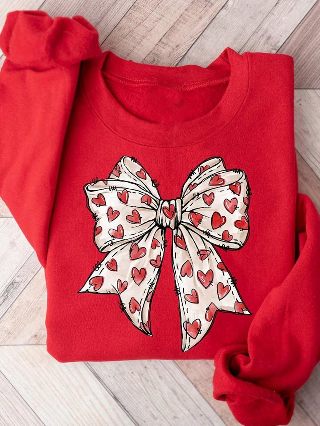 Spread the love this Valentine's Day with our Vintage Heart Bow Sweatshirt in Plus Size. Perfect for gifting to your loved ones!
