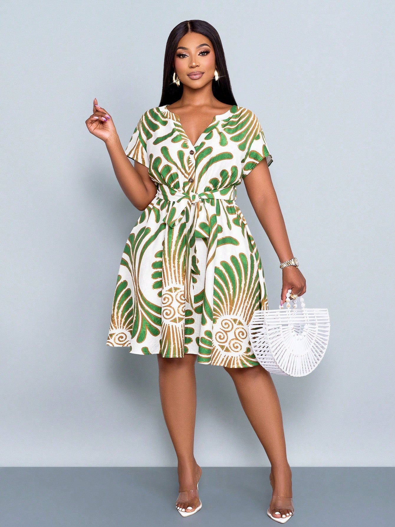 Step into sunshine with this playful plus size mini dress, featuring a vibrant tropical print in refreshing green. The flattering V-neck and button-front design add casual charm, while the breezy cut keeps you comfortable all day. Perfect for warm days, this dress brings a fun, flirty vibe to your wardrobe.