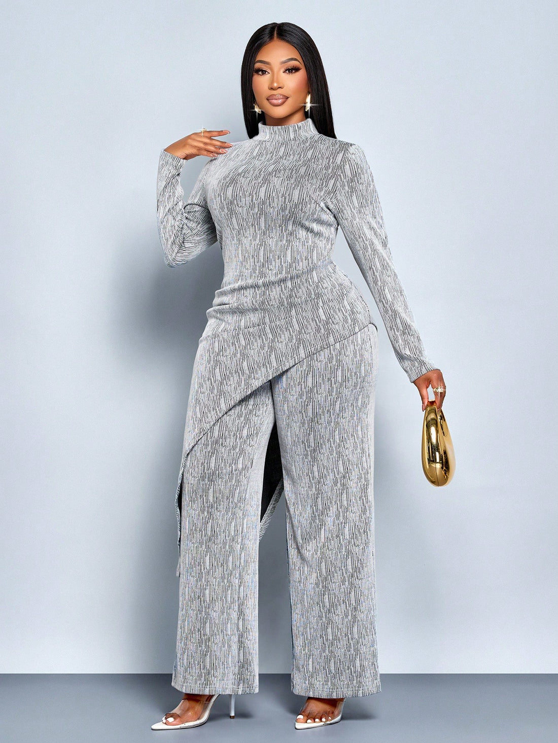 Stay cozy without sacrificing style in this fabulous plus-size set! The soft fleece top features a chic asymmetrical hem and ribbed detailing for a modern silhouette, while the flared pants add a fun, retro-inspired vibe. Perfect for layering through winter or wearing solo on milder days, this dynamic duo keeps you warm, comfortable, and absolutely fashion-forward. Embrace your curves and make a statement!