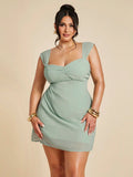 Celebrate your summer graduation in style with this playful plus size green mini dress. The ruched detailing flatters your curves while the sleeveless design keeps you cool and comfortable. Perfect for making a vibrant statement, this dress combines fun and elegance for your special day.