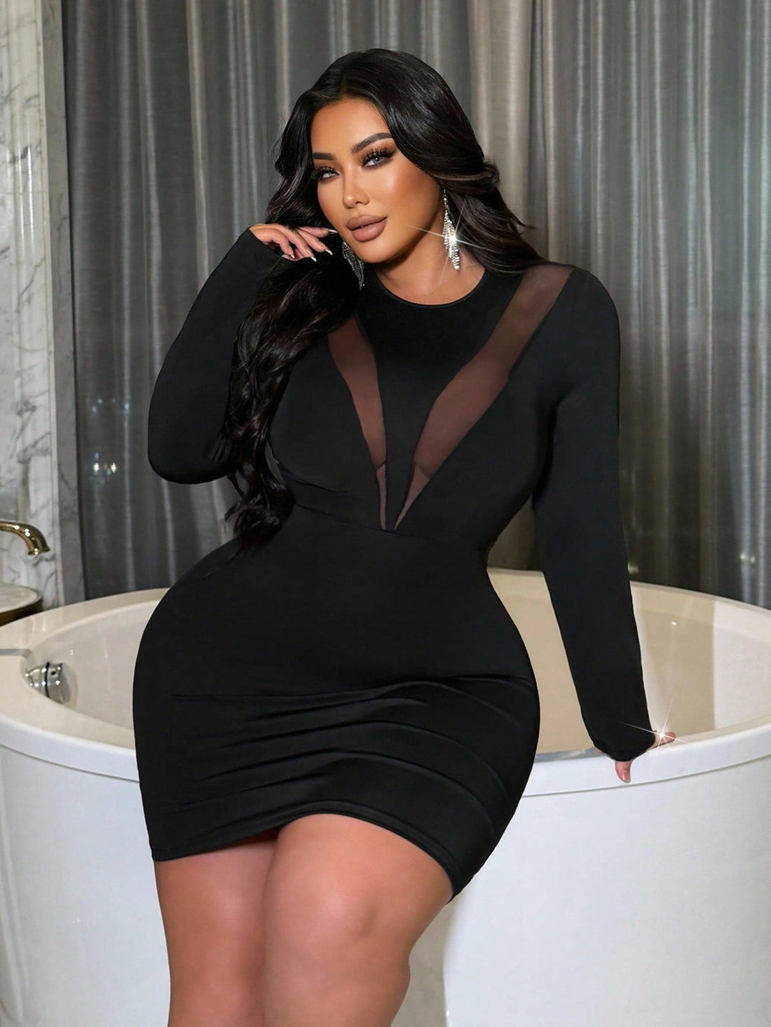 Turn heads with this playful plus size sheer mesh mini dress featuring daring patchwork and long sleeves. Designed to hug your curves, it offers a bold, confident look that's perfect for nights out or special occasions. Embrace your fearless style and sparkle with every step.