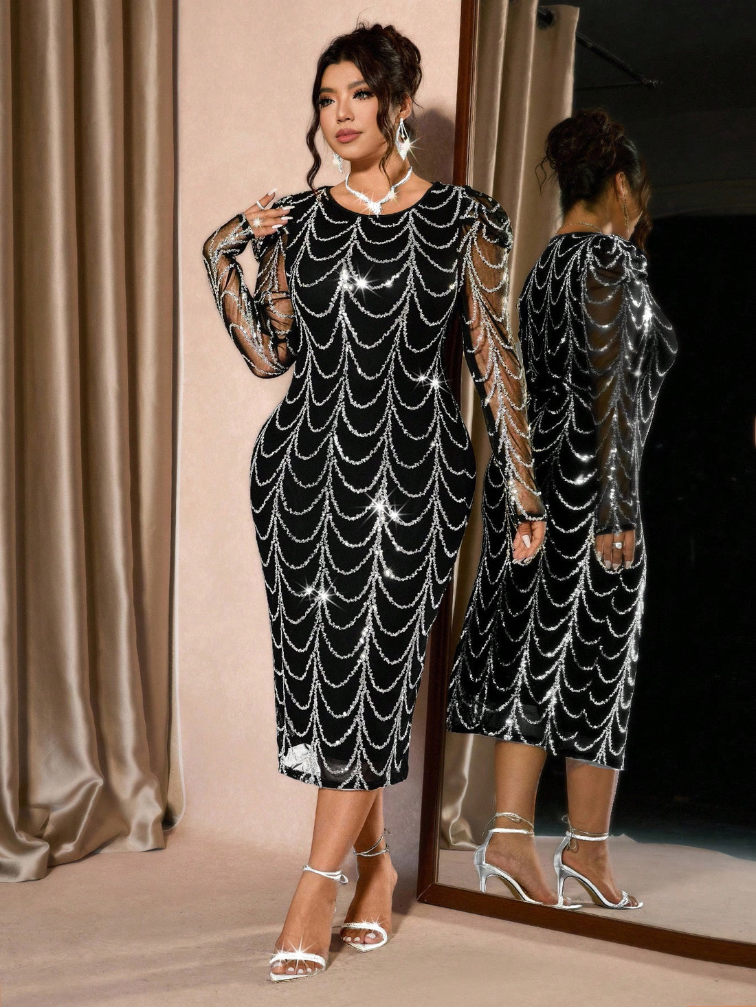 Slip into pure sophistication with this show-stopping plus-size dress that's all about making a statement. The shiny sheer fabric catches the light beautifully, while the flattering raglan sleeves create an effortlessly chic silhouette. With its round neckline and sexy cut, this dress is your go-to for nights when you want to feel absolutely fabulous. Whether you're heading out for a special occasion or just want to turn heads, this dress delivers glamour without the fuss. Confidence has never looked so goo