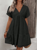 Flaunt your curves in this playful plus-size mini dress! The bubble plaid pattern adds a fun twist to your spring and summer wardrobe, while the flirty flare silhouette and flattering V-neckline create the perfect casual-chic look. Twirl into the season with confidence and style!