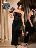 Front view of black plus-size strapless jumpsuit with floral lace bodice and wide legs
