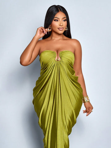 Slip into effortless elegance with this plus-size tube maxi dress that's ready to turn heads all season long. The rich grass green hue pairs beautifully with strategic ruching that flatters your silhouette, while delicate metal accents and graceful pleats add just the right amount of sophistication. Perfect for fall and winter gatherings, this dress transitions seamlessly from casual outings to special occasions. The tube design offers a sleek, modern look that celebrates your curves with confidence and sty