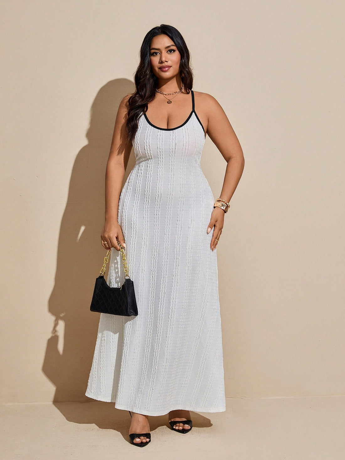 Embrace sunny days in this playful plus size cami dress, featuring eye-catching contrast binding and a delightfully textured fabric. Its breezy design keeps you cool and comfortable, perfect for casual outings or weekend fun. Flowy and flattering, it’s your go-to dress for effortless summer style with a splash of charm.