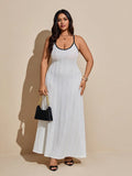 Embrace sunny days in this playful plus size cami dress, featuring eye-catching contrast binding and a delightfully textured fabric. Its breezy design keeps you cool and comfortable, perfect for casual outings or weekend fun. Flowy and flattering, it’s your go-to dress for effortless summer style with a splash of charm.