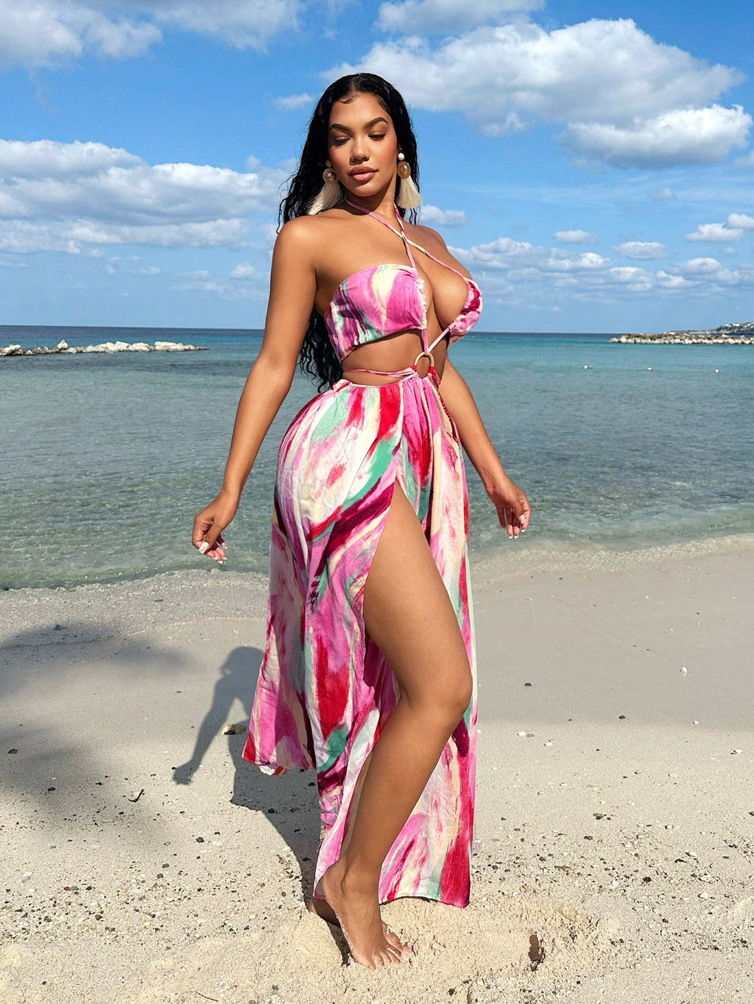 Get ready to turn heads in this playful Plus Size Women's Swing Dress! With a unique tie-dye pattern and a daring high slit, this dress is perfect for festivals, beach days, and nights out. The hollow ring detail adds a touch of whimsy to this must-have piece.