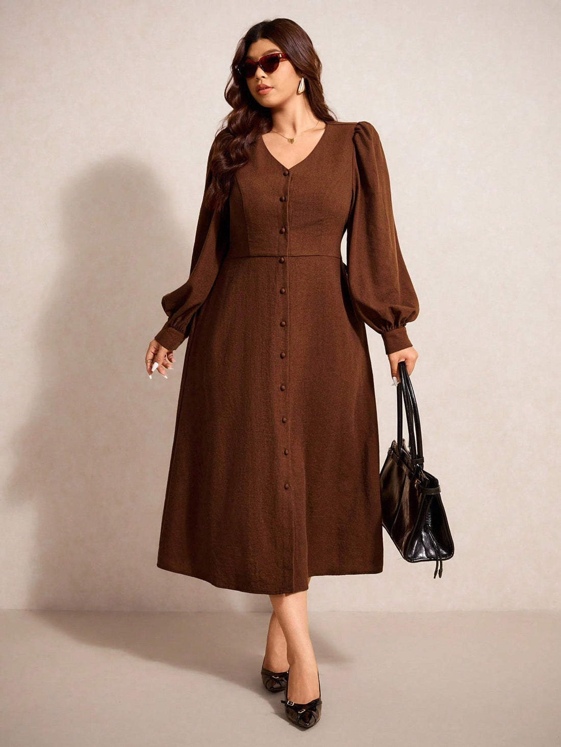 Embrace effortless style in this plus-size brown dress that's equal parts chic and cozy. The flattering V-neckline and long sleeves create a polished silhouette perfect for casual outings, weekend brunches, or laid-back office days. Crafted for comfort, this versatile piece pairs beautifully with sneakers, boots, or your favorite accessories. Whether you're running errands or meeting friends, this dress proves that looking fabulous doesn't require any fuss—just slip it on and go!