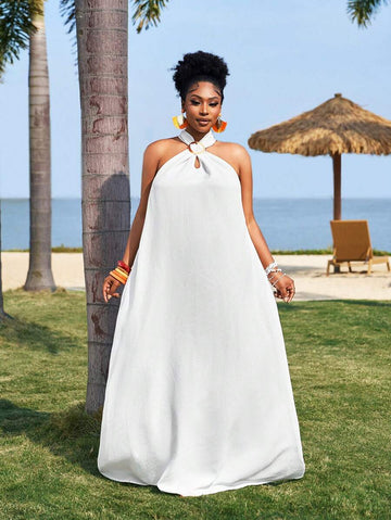 Embrace sunny days in this playful plus-size white dress, featuring a breezy sleeveless design and a flirty high-low hem. The textured woven fabric adds a touch of charm, making it perfect for casual spring outings or summer vacations. Lightweight and easy to wear, it’s your go-to for effortless style and comfort under the sun.