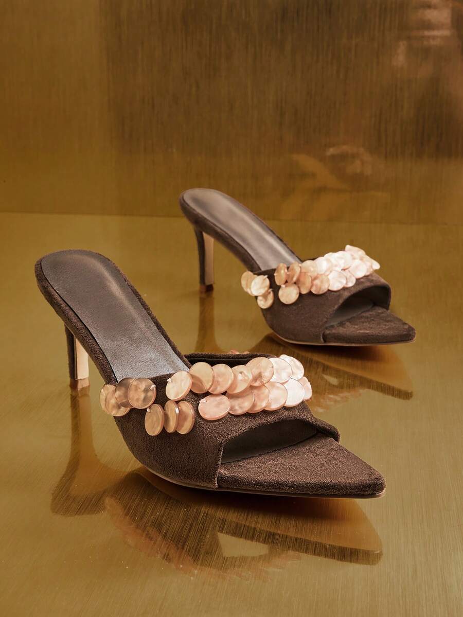 Front product view of brown embellished mule sandals with angular toes and slim heels
