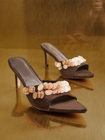 Front product view of brown embellished mule sandals with angular toes and slim heels