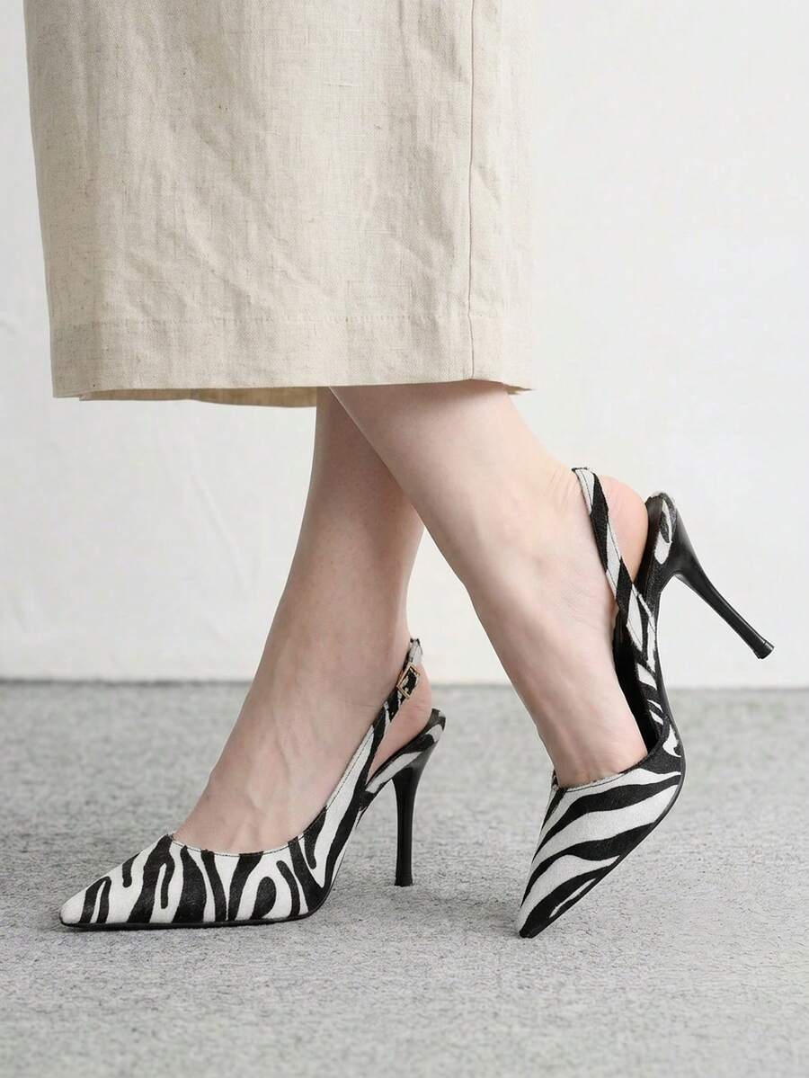 pair of black and white animal print pointed-toe slingback stiletto pumps