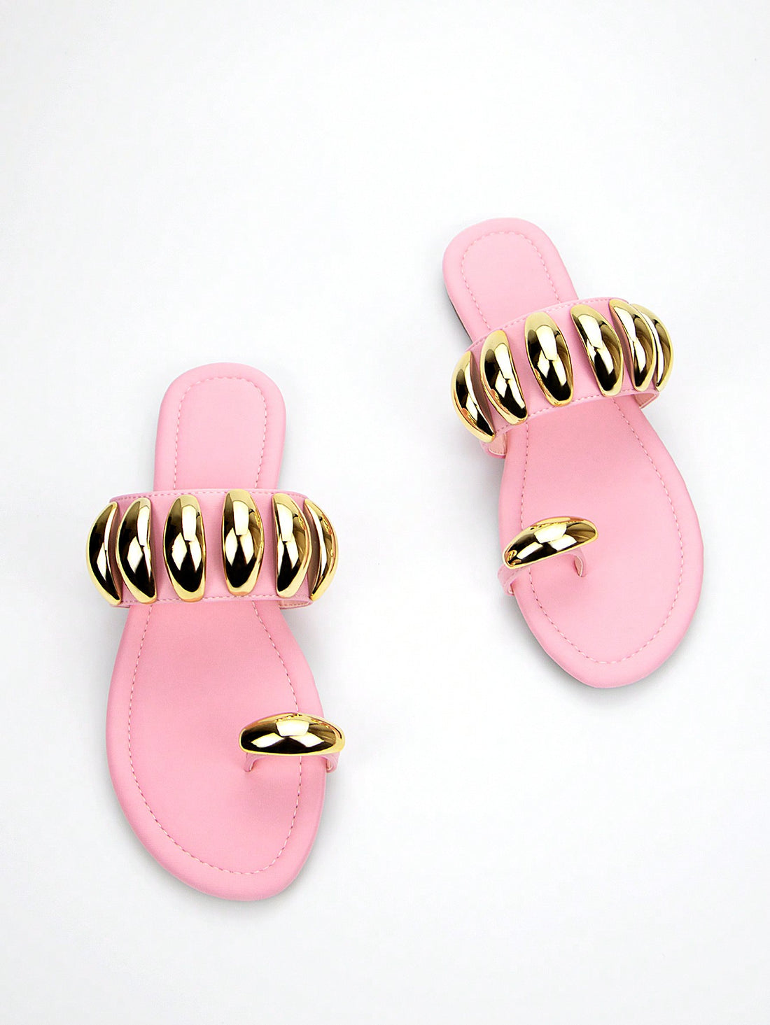 Add a touch of style and elegance to your summer wardrobe with Pretty in Pink: Stylish Lycra Flat Sandals. Made with high-quality lycra and featuring a stunning gold buckle detail, these sandals are not only stylish, but also comfortable to wear. Elevate any outfit and step out in confidence with these fashionable sandals.