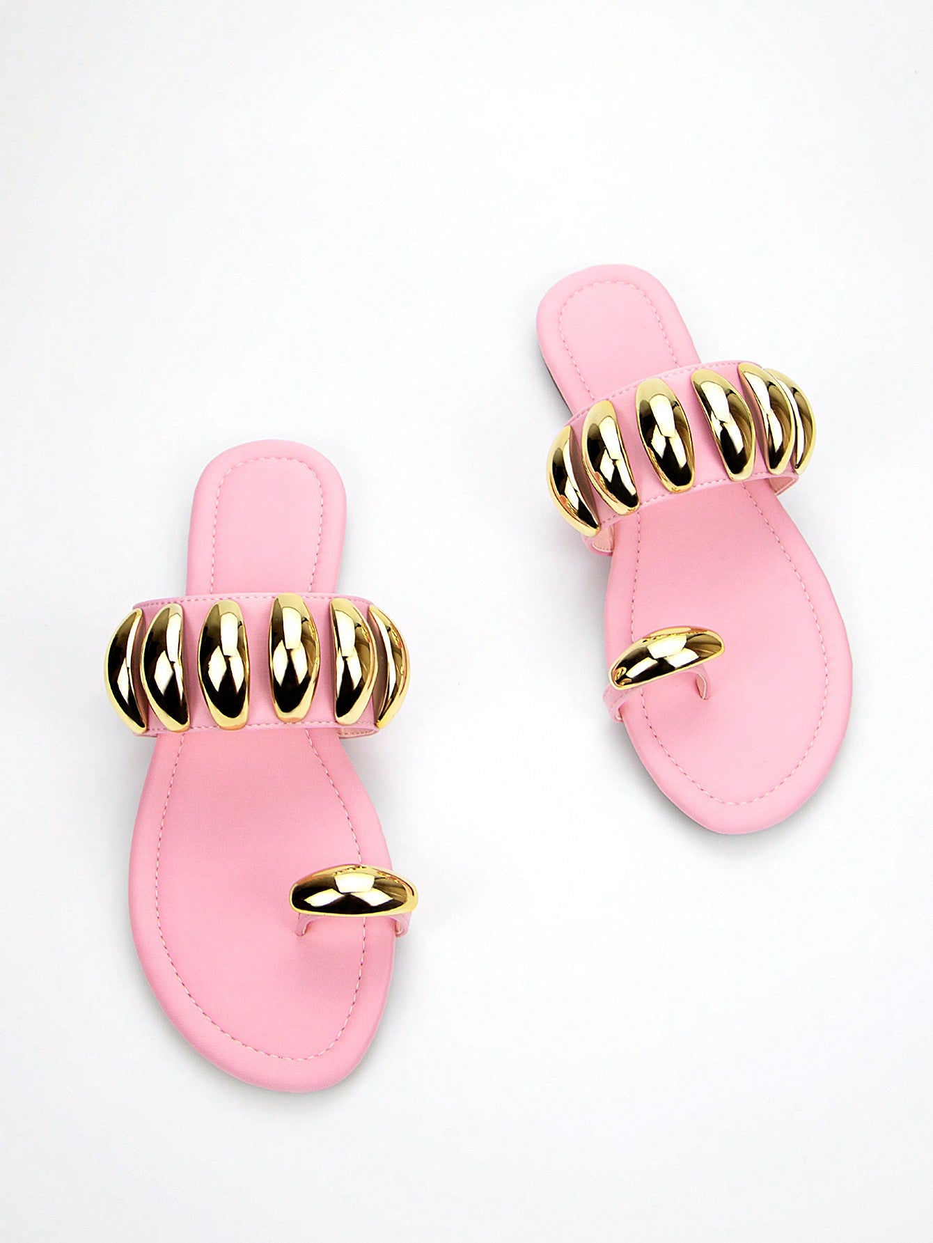 Add a touch of style and elegance to your summer wardrobe with Pretty in Pink: Stylish Lycra Flat Sandals. Made with high-quality lycra and featuring a stunning gold buckle detail, these sandals are not only stylish, but also comfortable to wear. Elevate any outfit and step out in confidence with these fashionable sandals.