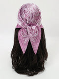 Elevate your beach and holiday wardrobe with this luxurious 70cm bandana scarf, featuring an elegant scroll pattern print. Versatile and stylish, this headwrap works beautifully as a hair accessory, neck scarf, or beach cover-up. The premium fabric drapes gracefully while maintaining its shape, making it perfect for sun protection and sophisticated styling. Whether you're lounging by the pool or exploring coastal destinations, this printed bandana adds a touch of refined elegance to any vacation look.