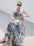 Step into summer with this playful Printed Chiffon Dream maxi dress. Featuring a flirty halter neck and stylish hollow-out details, it flows effortlessly for a breezy, elegant look. Perfect for sunny days and warm nights, this dress combines comfort with eye-catching charm to keep you twirling all season long.