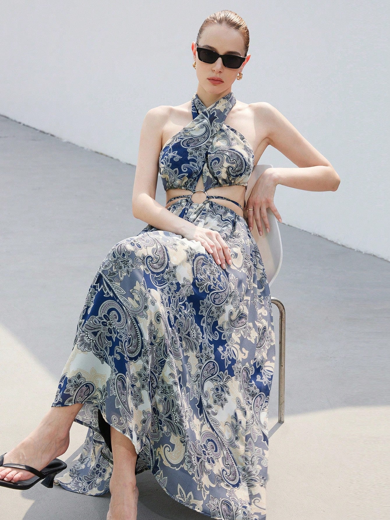Step into summer with this playful Printed Chiffon Dream maxi dress. Featuring a flirty halter neck and stylish hollow-out details, it flows effortlessly for a breezy, elegant look. Perfect for sunny days and warm nights, this dress combines comfort with eye-catching charm to keep you twirling all season long.