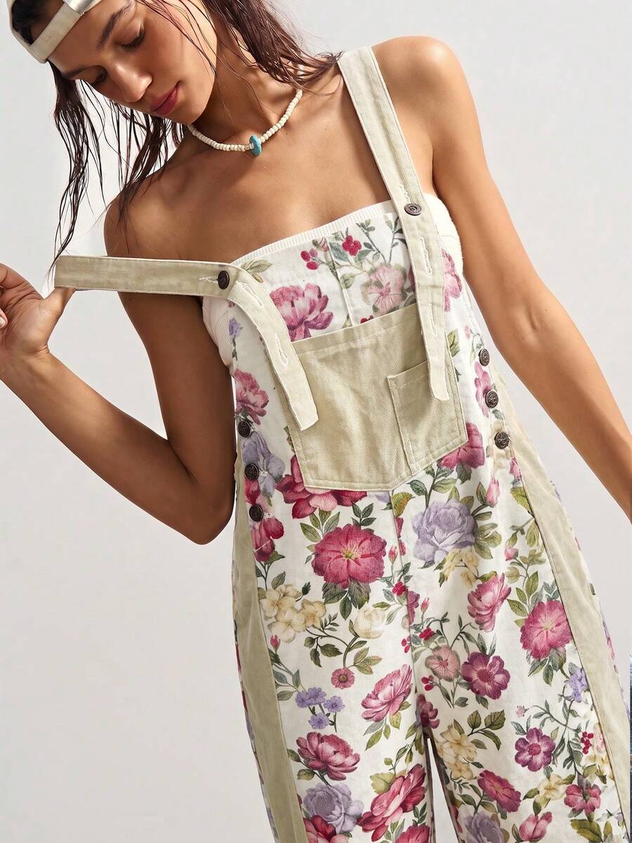 Close front view of cream floral woven suspender jumpsuit with bib pocket