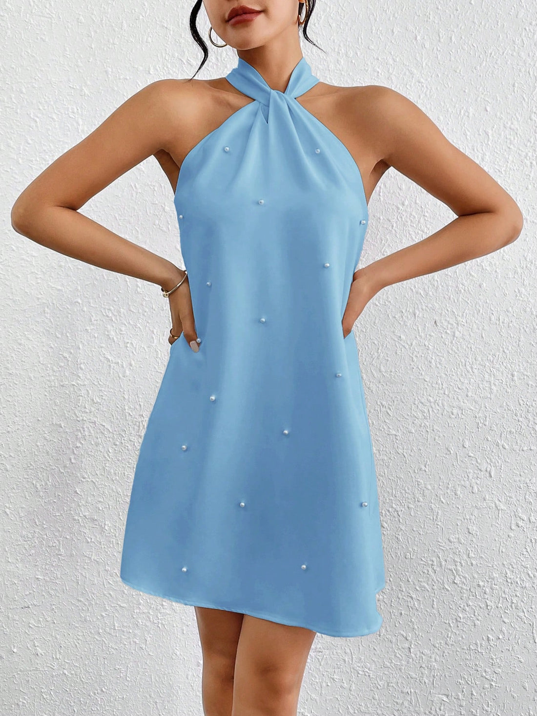 Experience luxurious comfort and style with Privé's Women's Loose Fit Pearl Decoration Halter Neck Dress. Perfect for summer, this dress features a loose fit for breezy movement and a halter neck for a chic look. Complete with pearl decorations, elevate your summer wardrobe with this elegant must-have.