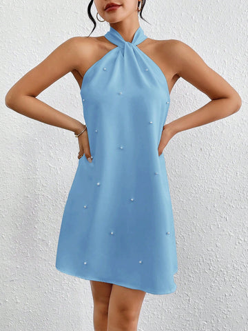 Experience luxurious comfort and style with Privé's Women's Loose Fit Pearl Decoration Halter Neck Dress. Perfect for summer, this dress features a loose fit for breezy movement and a halter neck for a chic look. Complete with pearl decorations, elevate your summer wardrobe with this elegant must-have.