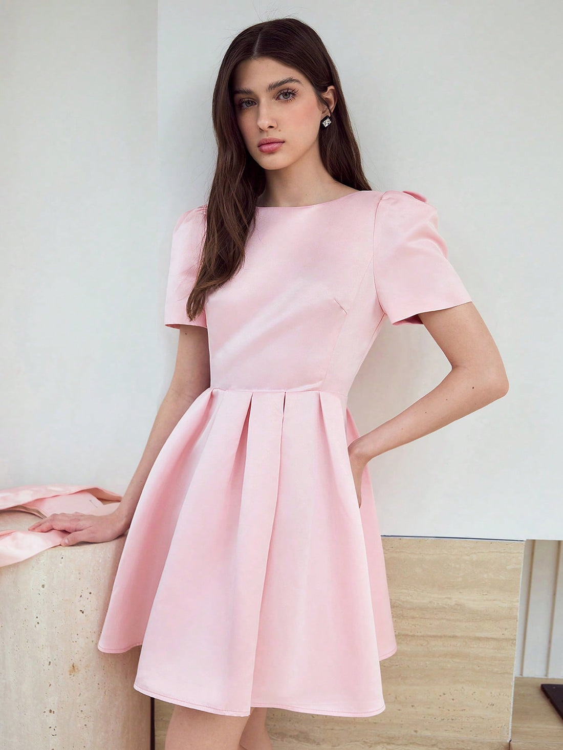 Step out in style with this playful Puff Sleeve Dress featuring a charming bow decor. Its voluminous sleeves add a flirty touch, while the bow detail brings a sweet, feminine flair. Perfect for any occasion, this dress effortlessly combines elegance with fun, making you the center of attention wherever you go.