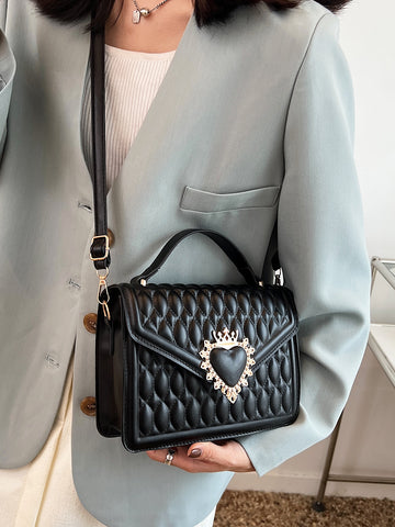 Indulge in the elegance and sophistication of our Quilted Crown Heart Decor Square Bag. This must-have accessory is perfect for the fashion-forward woman with its quilted design and stylish heart decoration. Crafted with precision, this bag is a timeless piece that will elevate any outfit.