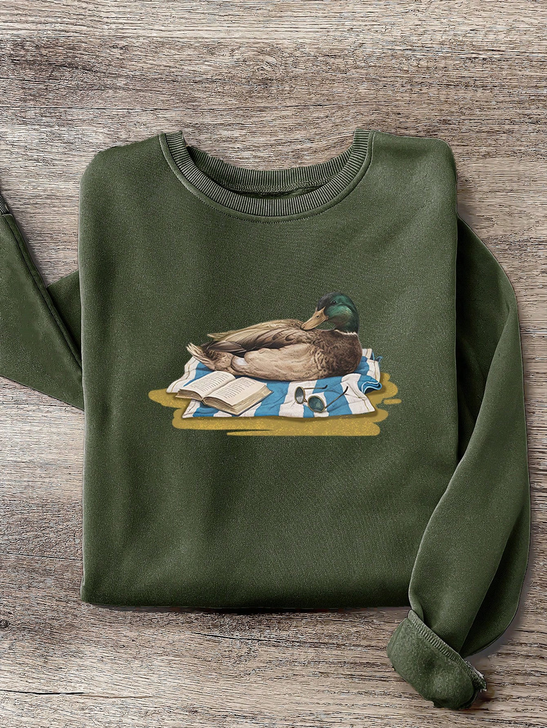 Stay cozy and stylish this autumn/winter with our Quirky Charm: Green Headed Duck Print Fleece Sweatshirt. Featuring a playful green headed duck print and soft fleece material, this sweatshirt is perfect for adding a quirky touch to your wardrobe. Get your quack on and embrace the colder months in style!