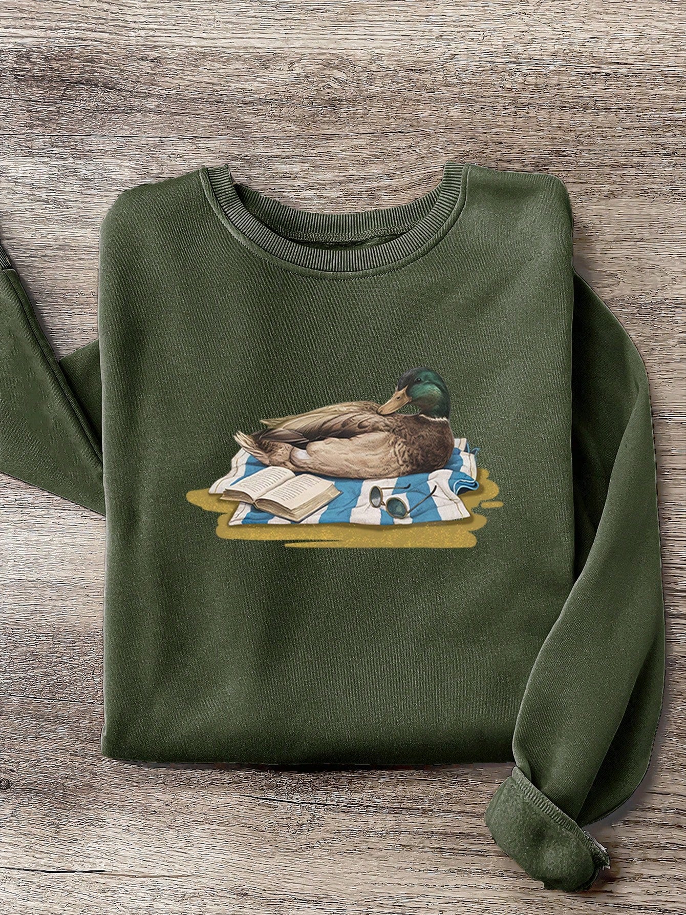 Stay cozy and stylish this autumn/winter with our Quirky Charm: Green Headed Duck Print Fleece Sweatshirt. Featuring a playful green headed duck print and soft fleece material, this sweatshirt is perfect for adding a quirky touch to your wardrobe. Get your quack on and embrace the colder months in style!