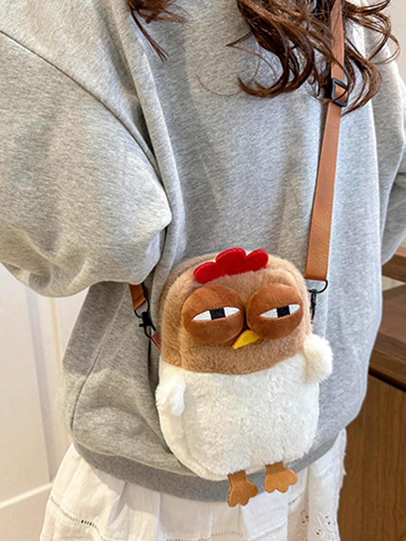 Add some whimsy to your wardrobe with our Quirky Khaki Plush Cartoon Animal Slant Shoulder Bag. This bag is perfect for anyone who loves fun fashion and wants to make a statement. With its unique design and plush material, it's sure to turn heads and make you stand out! (No boring bags here!)