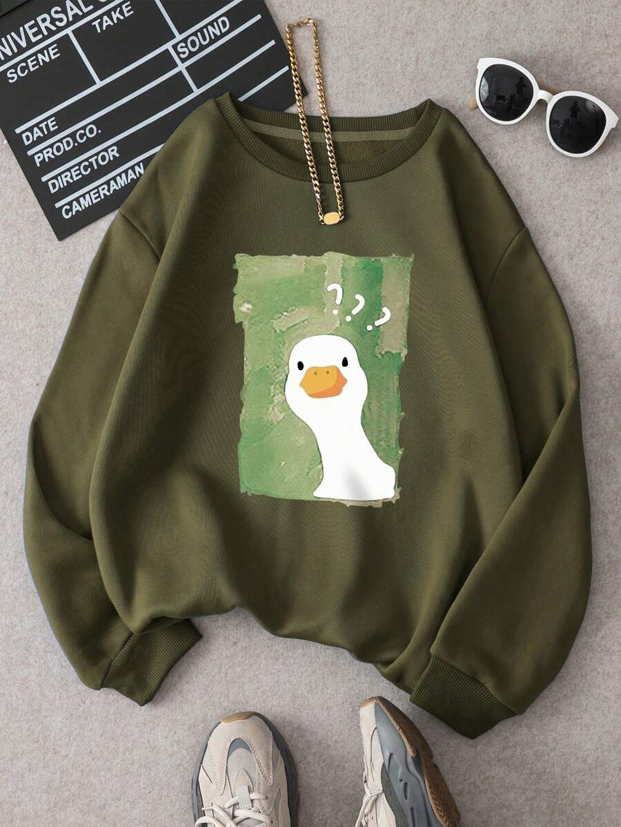 Add a splash of playful charm to your casual wardrobe with this Women's Quirky and Cute Cartoon Duck Printed Sweatshirt. Designed for those who love to stand out with unique, feel-good fashion, this piece brings a delightful energy to any cozy outfit.