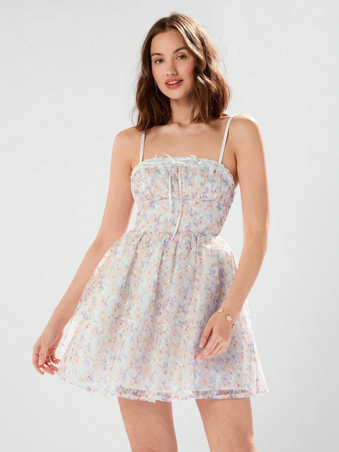 Slip into summer style with our Radiant Summer Elegance dress. Featuring ditsy floral patterns, delicate lace, and spaghetti straps, this dress exudes effortless elegance. Perfect for any sunny occasion, it's the epitome of chic and playful fashion.