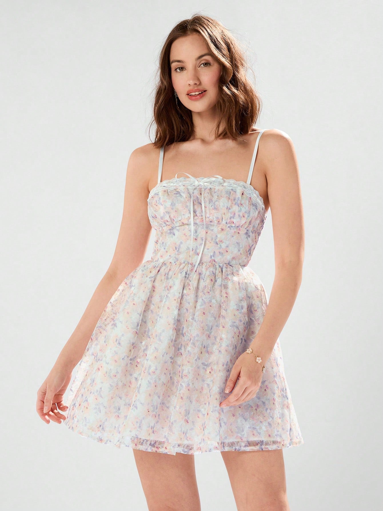 Slip into summer style with our Radiant Summer Elegance dress. Featuring ditsy floral patterns, delicate lace, and spaghetti straps, this dress exudes effortless elegance. Perfect for any sunny occasion, it's the epitome of chic and playful fashion.