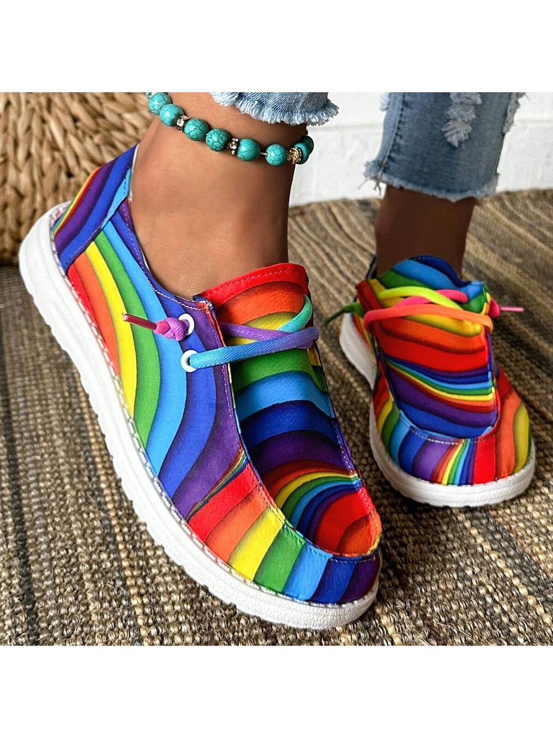 Introducing Rainbow Steps: Women's Colorful Printed Casual Sneakers. Embrace bold style with our vibrant, eye-catching design. Made from durable materials, these sneakers provide both fashion and function. Perfect for casual wear, these shoes will add a pop of color to any outfit. 