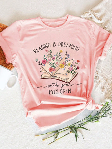 Dreaming of the perfect tee? Look no further than our Reading Is Dreaming Graphic T-Shirt! Perfect for book lovers and librarians alike, this casual short sleeve tee boasts a fun and quirky design that will make you stand out from the crowd. Embrace the power of reading and let your imagination run wild with this must-have shirt!