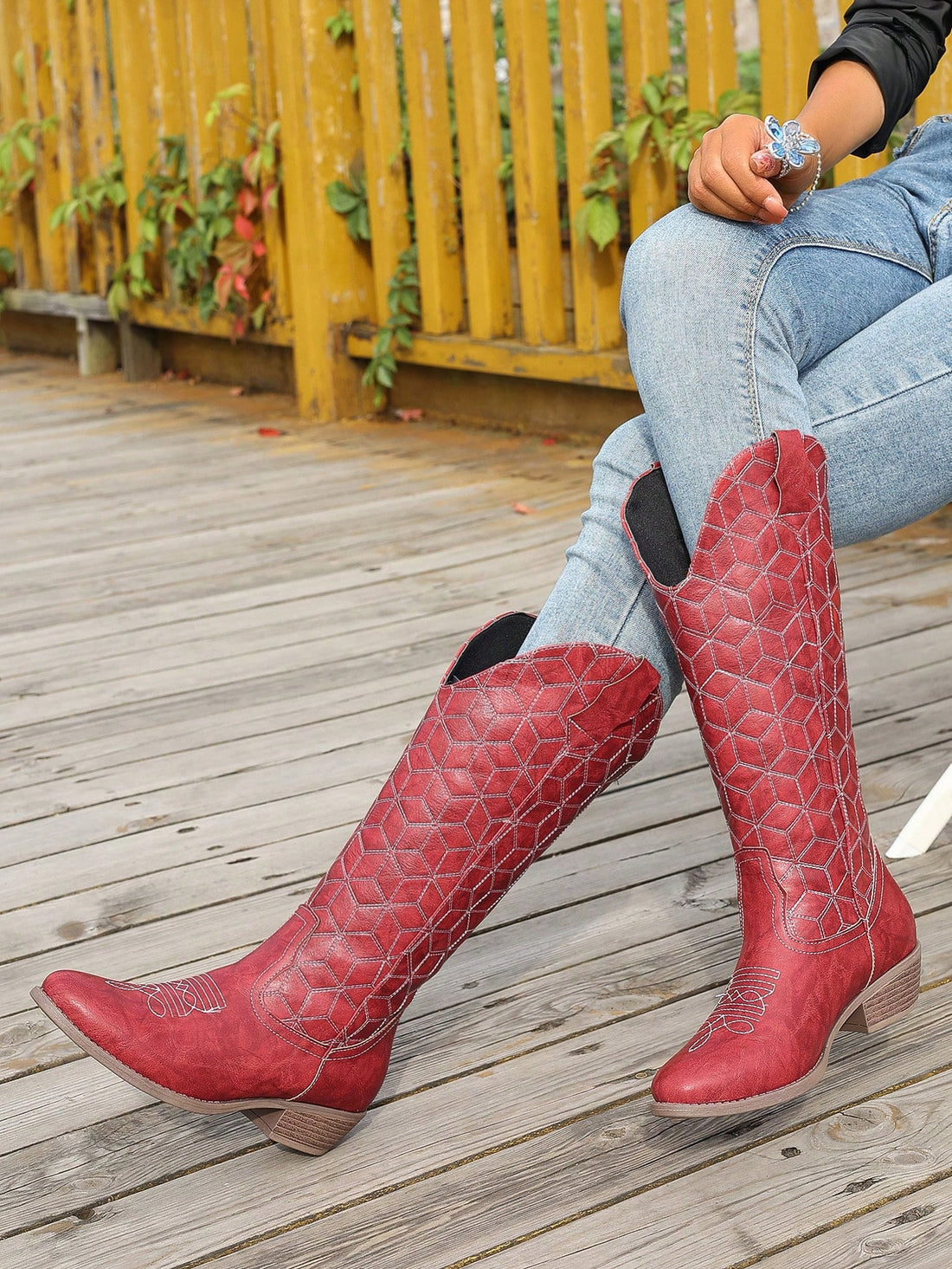 Add a bold statement to your outfit with our Red Checkerboard Patterned Western Style Boots. These boots feature a chunky heel for added support, a rounded toe for comfortable wear, and versatile elegance to complement any look. Make a statement while staying comfortable and stylish.