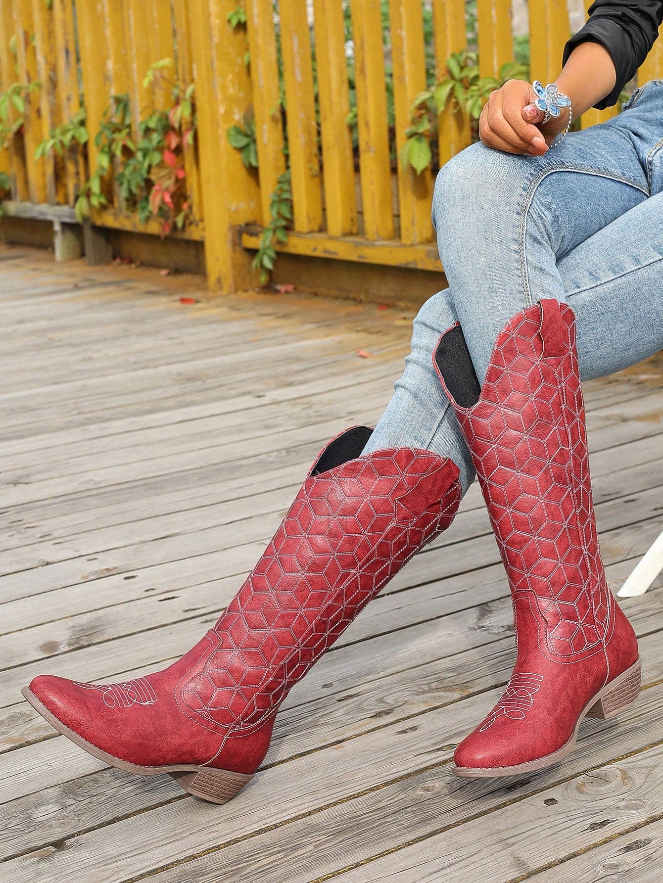 Add a bold statement to your outfit with our Red Checkerboard Patterned Western Style Boots. These boots feature a chunky heel for added support, a rounded toe for comfortable wear, and versatile elegance to complement any look. Make a statement while staying comfortable and stylish.
