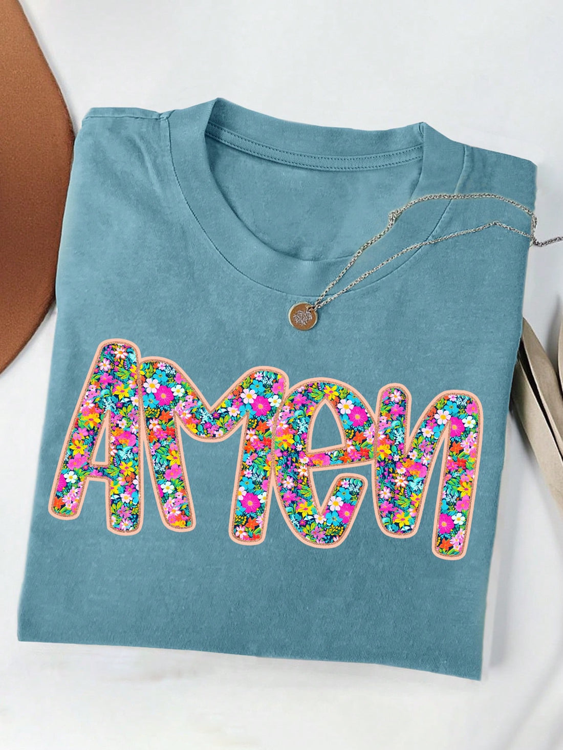 Add some fun to your summer wardrobe with our relaxed fit t-shirt. Featuring a playful letter print, this tee is perfect for a casual, laid-back look. The round neck design adds to the comfort and style of this quirky tee. Stay cool and stylish this summer with our must-have t-shirt!