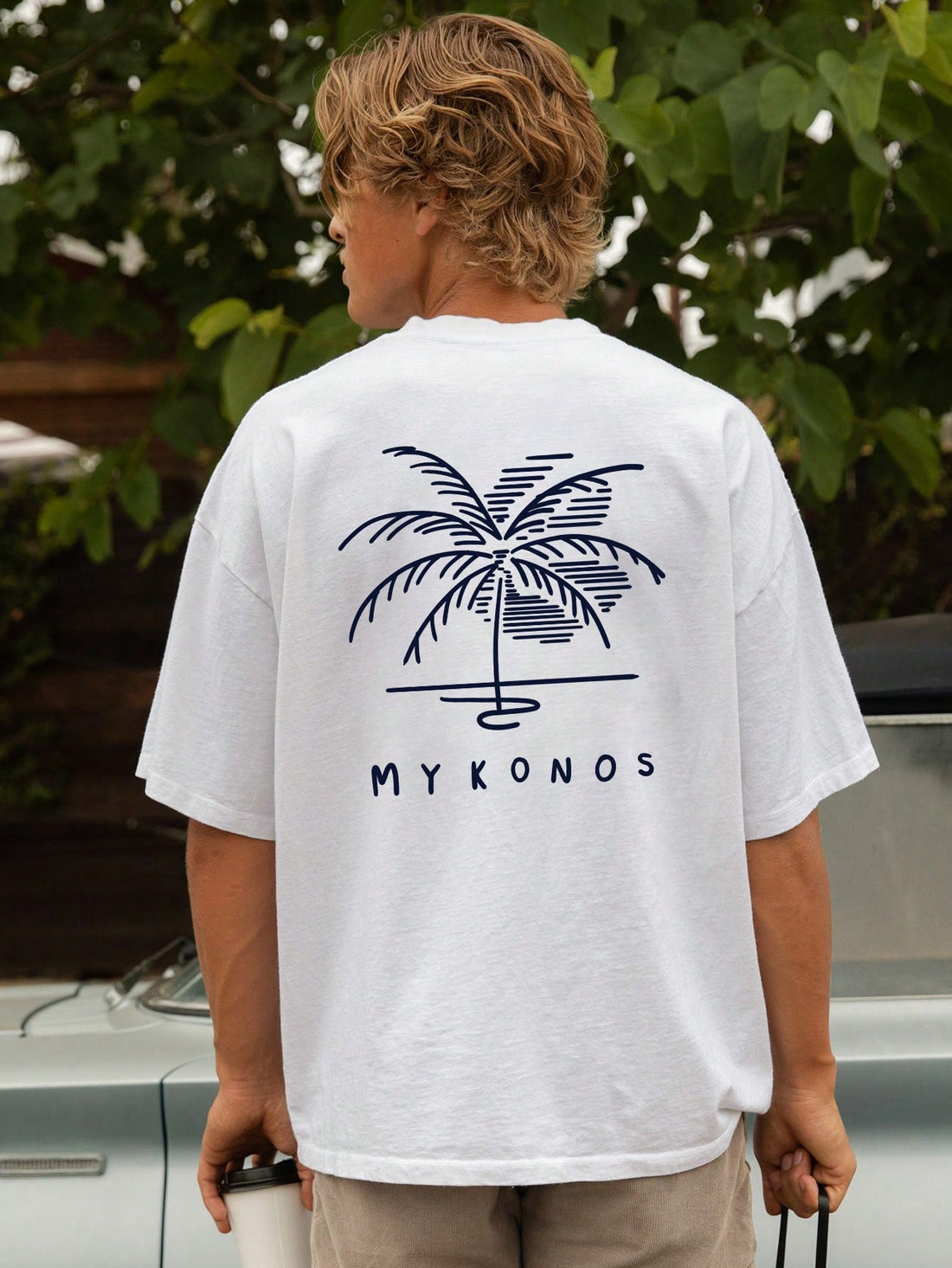 Unwind in the comfort of our Relaxed Vibes: Men's Coconut Tree Graphic Short Sleeve T-Shirt. Made from a soft and breathable cotton blend, this tee features a stylish graphic design of a coconut tree, perfect for adding a touch of laid-back style to your wardrobe. Embrace the relaxed vibes with this must-have t-shirt.