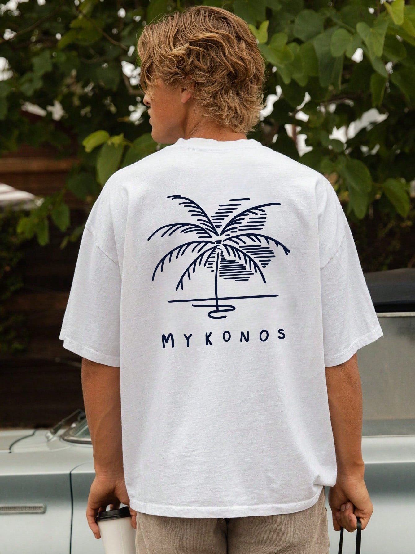 Unwind in the comfort of our Relaxed Vibes: Men's Coconut Tree Graphic Short Sleeve T-Shirt. Made from a soft and breathable cotton blend, this tee features a stylish graphic design of a coconut tree, perfect for adding a touch of laid-back style to your wardrobe. Embrace the relaxed vibes with this must-have t-shirt.