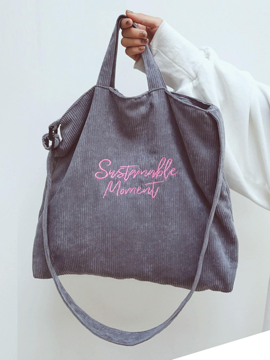 Introducing Retro Charm, the stylish tote bag for all your shopping needs. Made from lightweight vintage corduroy, this bag features a unique letter print design that adds a touch of retro charm to any outfit. Stay stylish and organized while shopping with this one-of-a-kind tote.