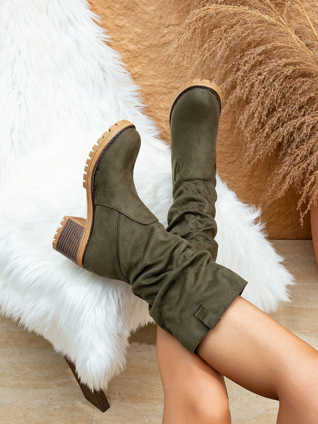 Elevate your fall/winter style with our Retro Chic Mid-Calf Western Boots. Crafted from soft suede, these boots feature a casual riding style that will add a touch of western charm to any outfit. Perfect for adding a vintage-inspired flair to your wardrobe.