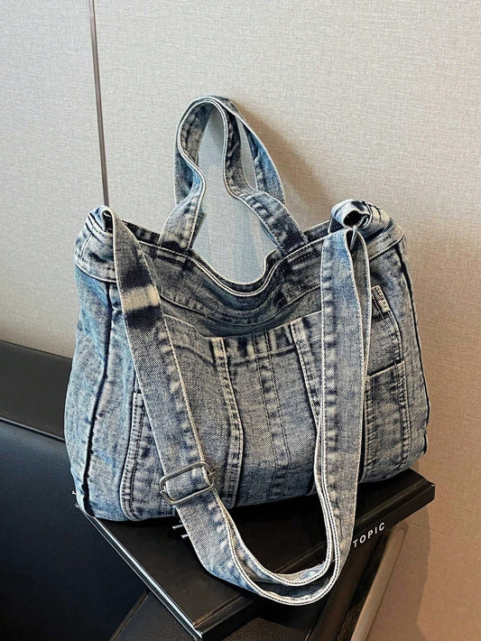 Discover the perfect blend of fashion and function with our Retro Chic Washed Jeans Tote Bag. Made from premium washed jeans, this stylish and durable tote features multiple pockets for easy organization, making it the ideal companion for school or commuting. Say goodbye to bulky bags and hello to effortless style and convenience.