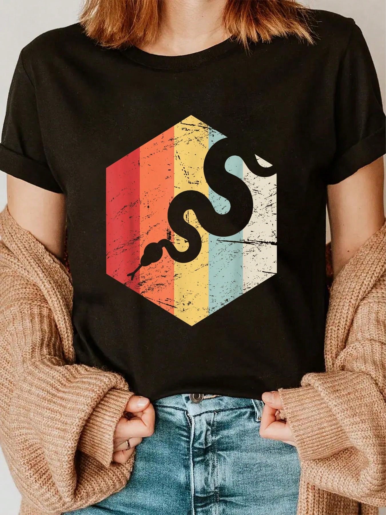 Add a bit of funky flair to your wardrobe with our Retro Distressed Snake Graphic Tee! This vintage-inspired casual wear is perfect for anyone looking for a unique and playful style. With a distressed snake graphic, this tee is sure to make a statement. Perfect for all occasions!