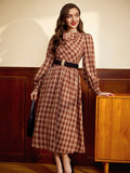 Get ready to turn heads in our Retro Elegant Winter Plaid Dress! This dress features a classic plaid pattern and belted waist to accentuate your curves. With long sleeves to keep you warm, you'll be the most stylish (and cozy) one in the room. Who says fashion can't be functional?