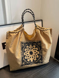 Expertly crafted with retro embroidery, this commuter tote is the perfect personalized bag for ladies and girls. Its timeless design adds a touch of elegance, while its spacious interior provides ample storage for all your essentials. Make a statement with this stylish and functional tote.