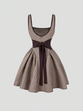 Step out in style with this Retro French Plaid Bow Tie-Up Camisole Dress. Featuring a flattering cinched waist and a flirty back cutout, it’s perfect for turning heads. The charming plaid pattern adds a vintage vibe, while the bow tie-up detail brings a playful touch. Ideal for sunny days or casual nights out, this dress combines comfort and sass effortlessly.
