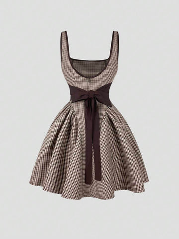 Step out in style with this Retro French Plaid Bow Tie-Up Camisole Dress. Featuring a flattering cinched waist and a flirty back cutout, it’s perfect for turning heads. The charming plaid pattern adds a vintage vibe, while the bow tie-up detail brings a playful touch. Ideal for sunny days or casual nights out, this dress combines comfort and sass effortlessly.