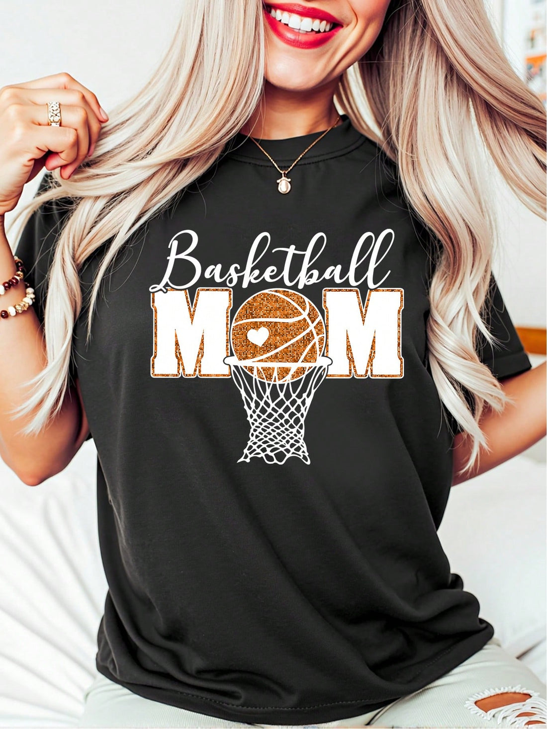 Get ready to cheer on your favorite baller with this Retro Glitter Basketball Mom Oversized Shirt! Perfect for holiday gatherings and gifting, this stylish and quirky shirt will make you the envy of the bleachers. Boldly show off your mom pride in this fun and playful shirt. (Dribble not included.)